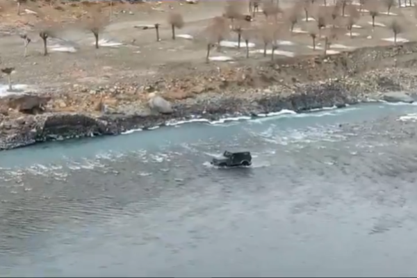 Driving car through the river